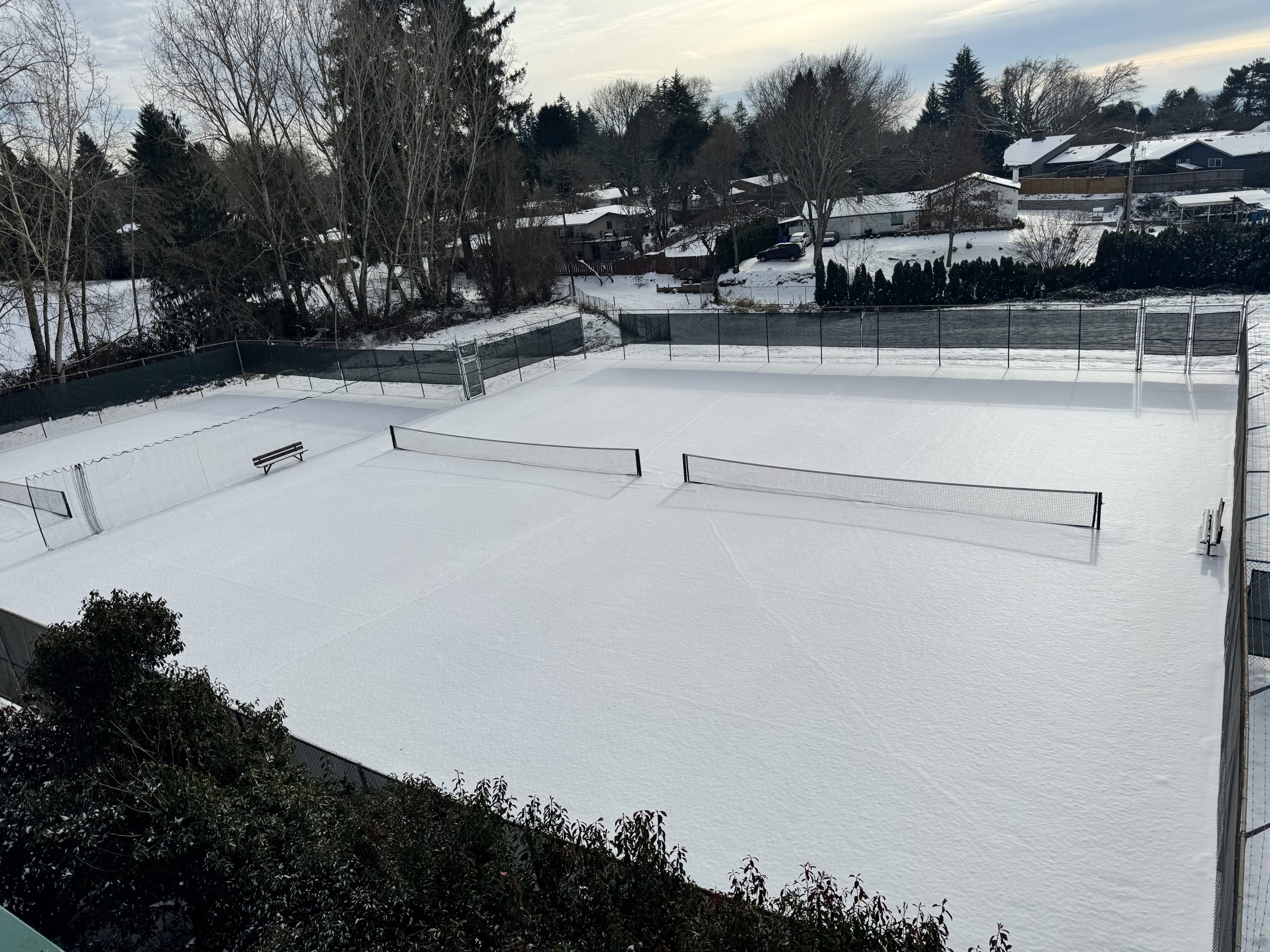 Our three outdoor tennis courts covered in a beautiful blanket of white snow.